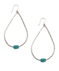 Decorate yourself in fresh, island style. These sleek hoops by Lucky Brand feature a small hint of color with a semi-precious calcite turquoise accent. Set in silver tone mixed metal. Approximate drop: 2-3/4 inches. Decorate yourself in fresh, island style. These sleek hoops by Lucky Brand feature a small hint of color with a semi-precious calcite turquoise accent. Set in silver tone mixed metal. Approximate drop: 2-3/4 inches.