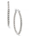 An elegant addition. These sterling silver hoop earrings from Victoria Townsend feature sparkling diamonds (1/4 ct. t.w.) for a stunning effect in any formal occasion. Approximate diameter: 1-1/8 inches.
