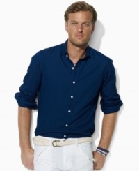 Crafted from dark-wash chambray, this essential button-down is tailored for a trim, modern fit and finished with an Estate collar for a refined look. Crafted from dark-wash chambray, this essential button-down is tailored for a trim, modern fit and finished with an Estate collar for a refined look.