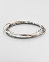 A beautiful blend of three stunning bangles in a chic, hammered texture. Sterling silverBlackened sterling silverSterling silver and 18k gold with 18k rose goldplatingDiameter, about 2.5Slip-on styleImported 