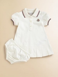 Soft, airy pique knit with sporty stripes, perfect for your future tennis star.Ribbed polo collar with two-color striped tippingShort sleeves with ribbed, tipped cuffsButton placketLogo appliqué at chestBox pleated hemMatching bloomers with elasticized waist and leg openings96% cotton/4% elastaneMachine washImported Please note: Number of buttons may vary depending on size ordered. Soft, airy pique knit with sporty stripes, perfect for your future tennis star.Ribbed polo collar with two-color striped tippingShort sleeves with ribbed, tipped cuffsButton placketLogo appliqué at chestBox pleated hemMatching bloomers with elasticized waist and leg openings96% cotton/4% elastaneMachine washImported Please note: Number of buttons may vary depending on size ordered.