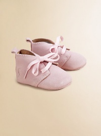 Adorable baby booties crafted in ultra-plush suede in a lace-up silhouette.Ribbon tieSuede upperLeather liningLeather solePadded insoleImported