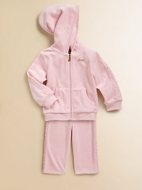 Plush and pretty, cozy and warm, in soft velour with feminine lace insets edging the sleeves and pants.Double layer hoodZip front with J pullGold Juicy chest embroideryRibbed cuffs and waistSplit kangaroo pocketElastic waist pantsCotton/polyesterMachine washImported Plush and pretty, cozy and warm, in soft velour with feminine lace insets edging the sleeves and pants.Double layer hoodZip front with J pullGold Juicy chest embroideryRibbed cuffs and waistSplit kangaroo pocketElastic waist pantsCotton/polyesterMachine washImported