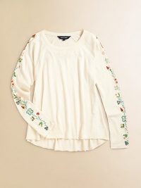 A delicate arrangement of beaded flowers adorns the sleeves of this adorable cotton jersey tee.Ribbed boatneckLong raglan sleevesPullover styleCurved frayed hemCottonMachine washImported A delicate arrangement of beaded flowers adorns the sleeves of this adorable cotton jersey tee.Ribbed boatneckLong raglan sleevesPullover styleCurved frayed hemCottonMachine washImported