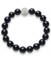 A traditional style with bold, modern appeal. This smooth strand bracelet showcases shiny onyx beads (10 mm) and a sparkling crystal ball at center (12 mm). Bracelet stretches to fit wrist. Approximate length: 7 inches.