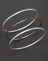 Two striking tones, three beautiful bangles from Gurhan, crafted in hammered white silver and dark silver.