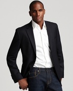 Dress it up or down. Two button sport coat with side vents. Slightly textured fabric, two front flap pockets.