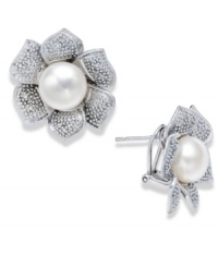 A true beauty. A cultured freshwater pearl (10 mm) and sparkling round-cut diamonds (1/10 ct. t.w.) adorn these exquisite flower-shaped stud earrings. Set in sterling silver. Approximate diameter: 1 inch.