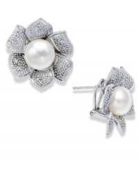 A true beauty. A cultured freshwater pearl (10 mm) and sparkling round-cut diamonds (1/10 ct. t.w.) adorn these exquisite flower-shaped stud earrings. Set in sterling silver. Approximate diameter: 1 inch. A true beauty. A cultured freshwater pearl (10 mm) and sparkling round-cut diamonds (1/10 ct. t.w.) adorn these exquisite flower-shaped stud earrings. Set in sterling silver. Approximate diameter: 1 inch.