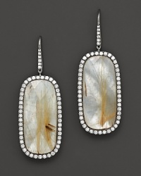 Diamonds circle faceted mother-of-pearl set in blackened sterling silver. By Di Massima.