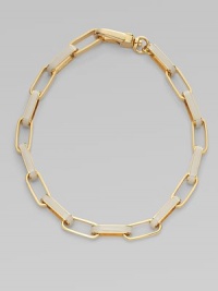 A chunky, statement piece with wide, enamal accented links. Plated brassEnamelLength, about 18¾Large lobster clasp closureImported A chunky, statement piece with wide, enamal accented links. Plated brassEnamelLength, about 18¾Large lobster clasp closureImported