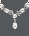 Cultured freshwater pearls (5.5-6mm) are paired with 14k white gold floral accents and shimmering diamond accents. Length measures 18 inches.