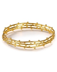 Stackable bangles from Gorjana in 18-karat gold vermeil are a delicate touch - now imagine how they stand out featuring delicate dot details. Stackable bangles from Gorjana in 18-karat gold vermeil are a delicate touch - now imagine how they stand out featuring delicate dot details.