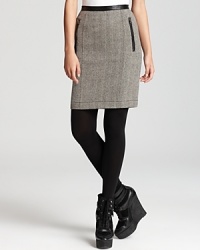Supple leather trim lends sophisticated edge to a tweed Burberry Brit pencil skirt for a polished style with a hint of punk attitude. Supple leather trim lends sophisticated edge to a tweed Burberry Brit pencil skirt for a polished style with a hint of punk attitude.
