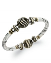 Charter Club's vintage-inspired bracelet will add a decorative flair to your collection with engraved accents and gold tones. Stretches to fit wrist. Crafted in silver tone mixed metal. Approximate diameter: 2-1/2 inches. Charter Club's vintage-inspired bracelet will add a decorative flair to your collection with engraved accents and gold tones. Stretches to fit wrist. Crafted in silver tone mixed metal. Approximate diameter: 2-1/2 inches.