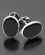 Pay attention to every detail. The handsome cufflinks feature onyx (9 x 7 mm) set in sterling silver.