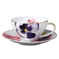 Pensees tea saucer by Bernardaud. This lively, luxurious saucer is sure to transform your table into a celebration of spring. The floral watercolor pattern features delicate, multicolored pansies that appear to be strewn across the surface of each piece. Pensees tea saucer by Bernardaud. This lively, luxurious saucer is sure to transform your table into a celebration of spring. The floral watercolor pattern features delicate, multicolored pansies that appear to be strewn across the surface of each piece.