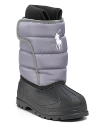 A breathable all-weather boot with a quilted waterproof upper, embroidered horse logo, cozy fleece lining and side Velcro® closure. A breathable all-weather boot with a quilted waterproof upper, embroidered horse logo, cozy fleece lining and side Velcro® closure.