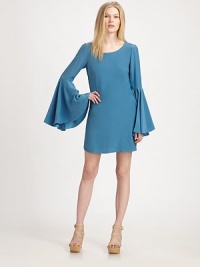 A vintage-inspired design of liquid-smooth silk, featuring dramatic bell sleeves for amplified style. JewelneckDropped shouldersLong bell sleeves with side slitsBack keyhole with single button closureAbout 33½ from shoulder to hemSilkDry cleanImportedModel shown is 5'10 (177cm) wearing US size Small. A vintage-inspired design of liquid-smooth silk, featuring dramatic bell sleeves for amplified style. JewelneckDropped shouldersLong bell sleeves with side slitsBack keyhole with single button closureAbout 33½ from shoulder to hemSilkDry cleanImportedModel shown is 5'10 (177cm) wearing US size Small.