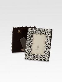 A keepsake accent for life's favorite moments and people, upholstered in smooth leather with 14k gold- or platinum-plated flowers dewy with faceted Swarovski crystals. Accommodates a 2 X 3 photograph Hand wipe Imported A keepsake accent for life's favorite moments and people, upholstered in smooth leather with 14k gold- or platinum-plated flowers dewy with faceted Swarovski crystals. Accommodates a 2 X 3 photograph Hand wipe Imported