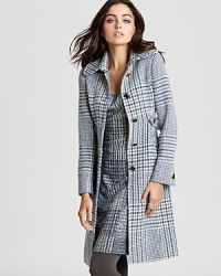 Striking a balance between masculine and feminine, a Tory Burch coat flaunts a menswear-inspired silhouette emboldened by an chic plaid print. Striking a balance between masculine and feminine, a Tory Burch coat flaunts a menswear-inspired silhouette emboldened by an chic plaid print.