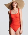 Elevate your poolside portfolio with Profile's solid one piece swimsuit. With a classic look and ruched detailing, this style is chic under a loose white shirt and straw fedora.