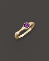 A faceted amethyst and a brilliant diamond add bright color to gleaming 18K yellow gold. By Carelle.