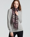 In soft cashmere, this luxe Burberry scarf boasts the brand's signature check print in purple with pink accents.