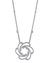 From the Cignature collection, a white gold and diamond pendant on a chain. Designed by Charriol.