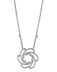 From the Cignature collection, a white gold and diamond pendant on a chain. Designed by Charriol.