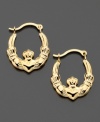 Friendship, love and loyalty. These claddagh hoop earrings are crafted in 14k gold. Approximate diameter: 1/4 inch.