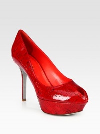 Vibrant, laminated cork silhouette has a slight, unexpected peep toe and towering heel. Self-covered heel, 4 (100mm)Covered platform, 1 (25mm)Compares to a 3 heel (75mm)Laminated cork upperLeather lining and solePadded insoleMade in ItalyOUR FIT MODEL RECOMMENDS ordering one half size up as this style runs small. Vibrant, laminated cork silhouette has a slight, unexpected peep toe and towering heel. Self-covered heel, 4 (100mm)Covered platform, 1 (25mm)Compares to a 3 heel (75mm)Laminated cork upperLeather lining and solePadded insoleMade in ItalyOUR FIT MODEL RECOMMENDS ordering one half size up as this style runs small.