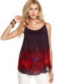 A back cutout adds unexpected edge to this printed Free People tank while the floral-printed straps keeps it feminine!