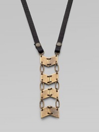 A stunning pendant formed of linked antiqued brass panels boldly suspends from a strap of Italian leather.BrassLeatherLength, about 27½Lobster claspMade in USA A stunning pendant formed of linked antiqued brass panels boldly suspends from a strap of Italian leather.BrassLeatherLength, about 27½Lobster claspMade in USA