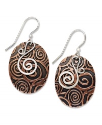 You'll be entranced by Jody Coyote's hypnotic style. Swirls of sterling silver combine with engraved copper on these oval-shaped drop earrings. Approximate drop: 1-1/2 inches. You'll be entranced by Jody Coyote's hypnotic style. Swirls of sterling silver combine with engraved copper on these oval-shaped drop earrings. Approximate drop: 1-1/2 inches.