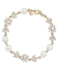 Stunning style is in bloom. Carolee combines imitation pearls and sparkling glass accents into a detailed floral-shaped pattern on this gorgeous link bracelet. Crafted in gold tone mixed metal. Approximate length: 7-1/2 inches.