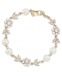 Stunning style is in bloom. Carolee combines imitation pearls and sparkling glass accents into a detailed floral-shaped pattern on this gorgeous link bracelet. Crafted in gold tone mixed metal. Approximate length: 7-1/2 inches. Stunning style is in bloom. Carolee combines imitation pearls and sparkling glass accents into a detailed floral-shaped pattern on this gorgeous link bracelet. Crafted in gold tone mixed metal. Approximate length: 7-1/2 inches.