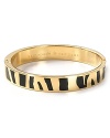 Go wild for kate spade new york with this skinny gold-plated bangle, splashed with a zebra print. It's a playful way to show your stripes.
