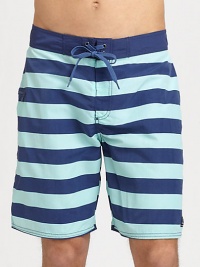 Stay stylish in the sun, the sand and beyond in these striped board shorts shaped in lightweight, breathable cotton.Drawstring tie waistSide welt pocketInseam, about 8NylonMachine washImported Stay stylish in the sun, the sand and beyond in these striped board shorts shaped in lightweight, breathable cotton.Drawstring tie waistSide welt pocketInseam, about 8NylonMachine washImported
