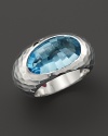 Faceted blue topaz set in a sculpted sterling silver band. By Roberto Coin.
