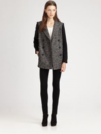 This sophisticated silhouette sports a textural tweed body and cozy knit sleeves