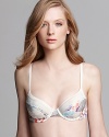 Match your sweet side in a pretty floral printed demi bra from Calvin Klein.