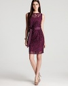 Luxe in lace, Tadashi Shoji's ladylike dress shows off a sleeveless silhouette and a flattering, ribbon-detailed waist.