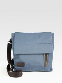 Front vertical zip pocket and textured applique make up this classic crossover bag with flap closure and adjustable shoulder strap for added versatility and comfort.Flap closureAdjustable shoulder strapExterior, interior zip pocketFully linedPolyamide13W x 13H x 2DImported Front vertical zip pocket and textured applique make up this classic crossover bag with flap closure and adjustable shoulder strap for added versatility and comfort.Flap closureAdjustable shoulder strapExterior, interior zip pocketFully linedPolyamide13W x 13H x 2DImported