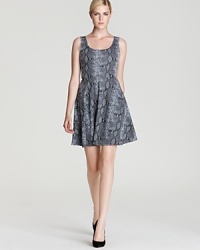 A fit-and-flare silhouette makes this skater-style dress ultra flattering. Work it all season long to flirty effect -- no triple axels necessary! A fit-and-flare silhouette makes this skater-style dress ultra flattering. Work it all season long to flirty effect -- no triple axels necessary!
