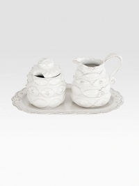 A charming, richly textured three-piece ceramic set fit for the breakfast nook and dinner table alike includes a lidded sugar bowl, creamer and scalloped tray. Sugar, 4½H X 3¼ diameter Creamer, 4½H X 4½ diameter Tray, 10L Dishwasher safe Imported A charming, richly textured three-piece ceramic set fit for the breakfast nook and dinner table alike includes a lidded sugar bowl, creamer and scalloped tray. Sugar, 4½H X 3¼ diameter Creamer, 4½H X 4½ diameter Tray, 10L Dishwasher safe Imported