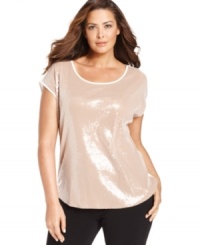 Let your style shine this season with Calvin Klein's short sleeve plus size top, showcasing a sequined front. Let your style shine this season with Calvin Klein's short sleeve plus size top, showcasing a sequined front.