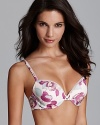 Perfect under low-cut tops and rendered in a pretty floral print, Calvin Klein's push-up bra gives enviable shape. Style #F3317.