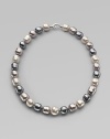 A soft melange of grey, nuage and white baroque man-made pearls creates drama at the neck. 14mm multicolor organic baroque pearls Length, about 20 Sterling silver spring clip clasp Made in Spain