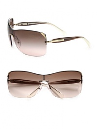 Ultra-lightweight in rimless metal, these over-sized shield sunglasses evoke an eternally cool feeling. Available in pale gold with brown gradient lens or gunmetal with gray gradient lens.Metal logo templesUV400 lensMade in Italy Ultra-lightweight in rimless metal, these over-sized shield sunglasses evoke an eternally cool feeling. Available in pale gold with brown gradient lens or gunmetal with gray gradient lens.Metal logo templesUV400 lensMade in Italy
